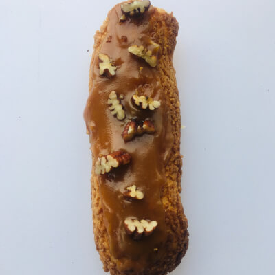 2 Vanilla Eclairs With Caramel And Pecan Topping