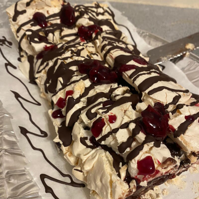 Pastry Studio- Meringue Roulade With Chocolate And Berries Topped With Hazelnuts